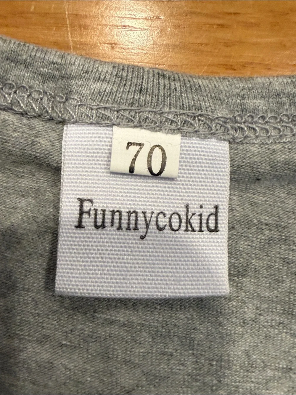 Funnycokid baby onesie Newest Member of the pack size 0-3.